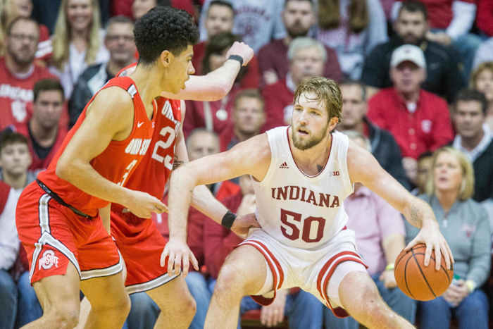 Indiana's Joey Brunk makes a move toward the basket against Ohio State defenders. (Mandatory credit: USA TODAY SPORTS)